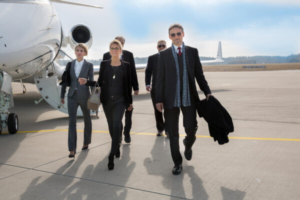 executive business team leaving corporate jet