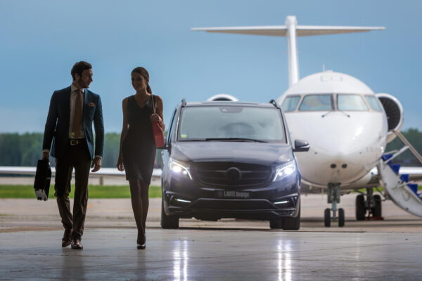 DOMODEDOVO, MOSCOW, RUSSIA - JUNE 03, 2016: Private busines Jet airplane with Mercedes Benz V-class luxury car with tuning kit of Larte Design Tuning Company shown together at international airport